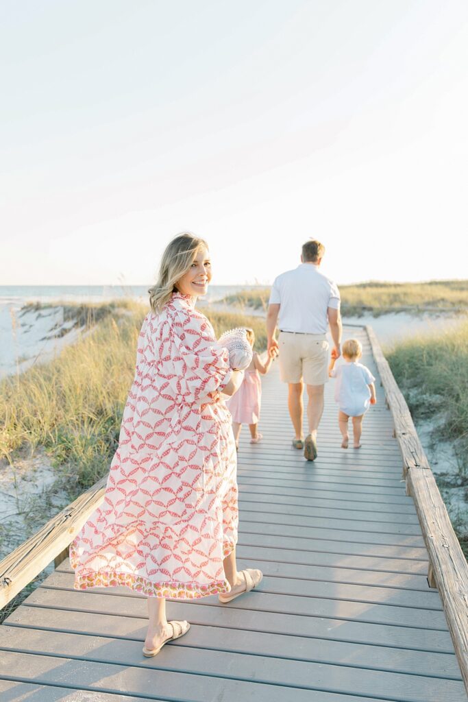 family walking along the boardwalk in Destin, FL
